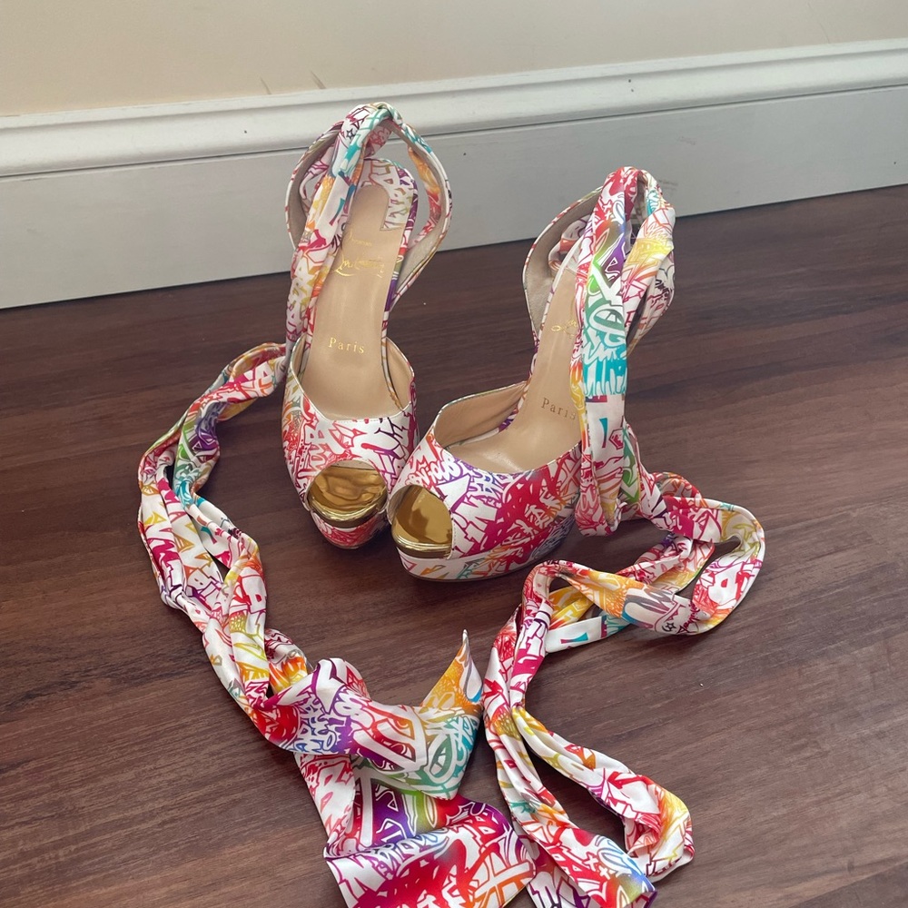Louboutin floral tie up heel. Size 36 1/2 preowned. Originally $995.